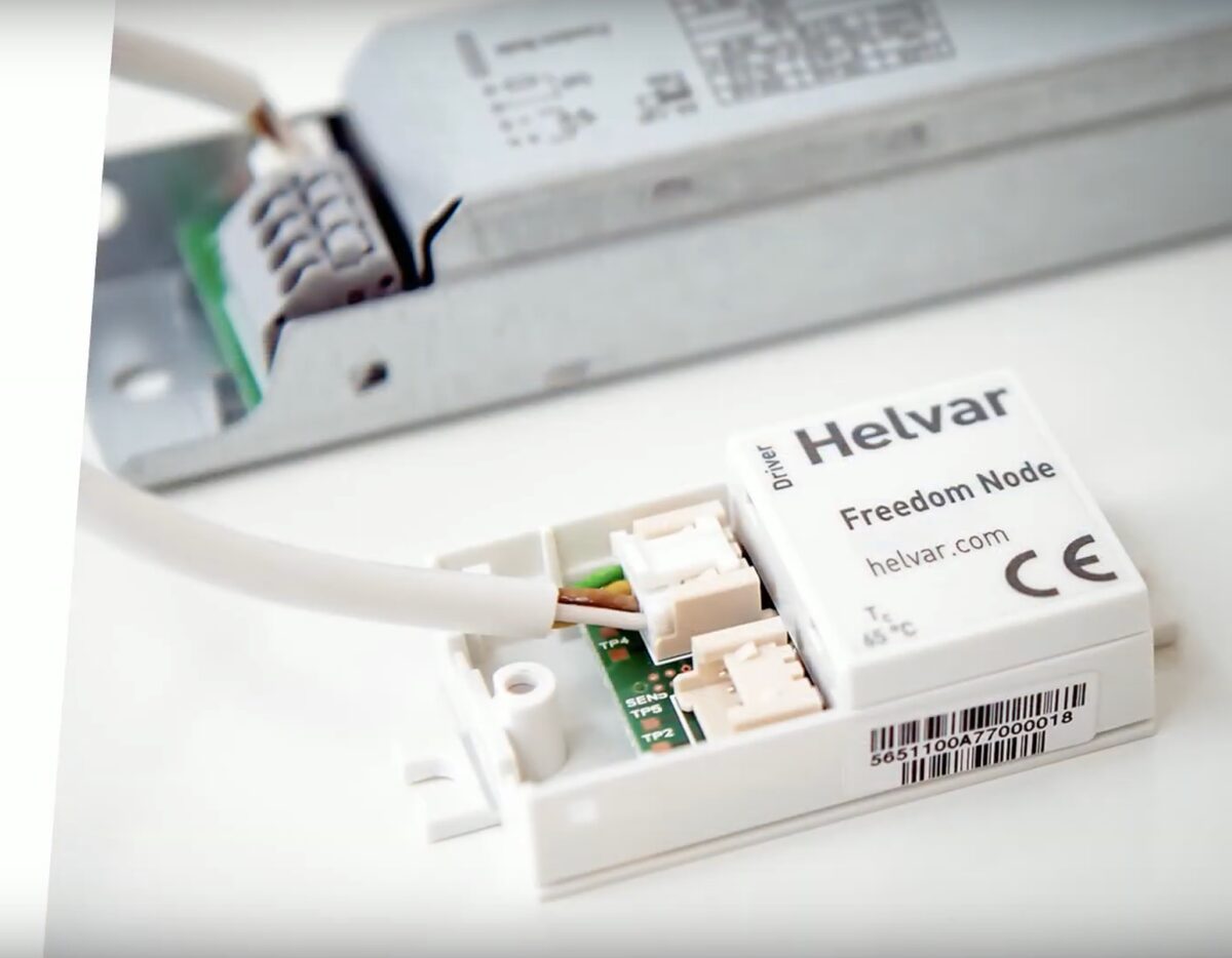 Helvar Freedom Node radio unit plugged into an LED driver by its connector cable