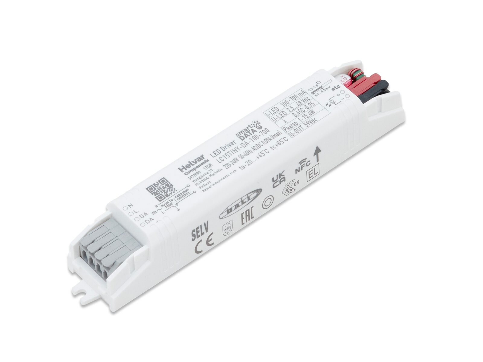 Helvar LC15TINY-DA-100-700, a long slim white LED driver, with its strain relief cover open to show the push-in terminals