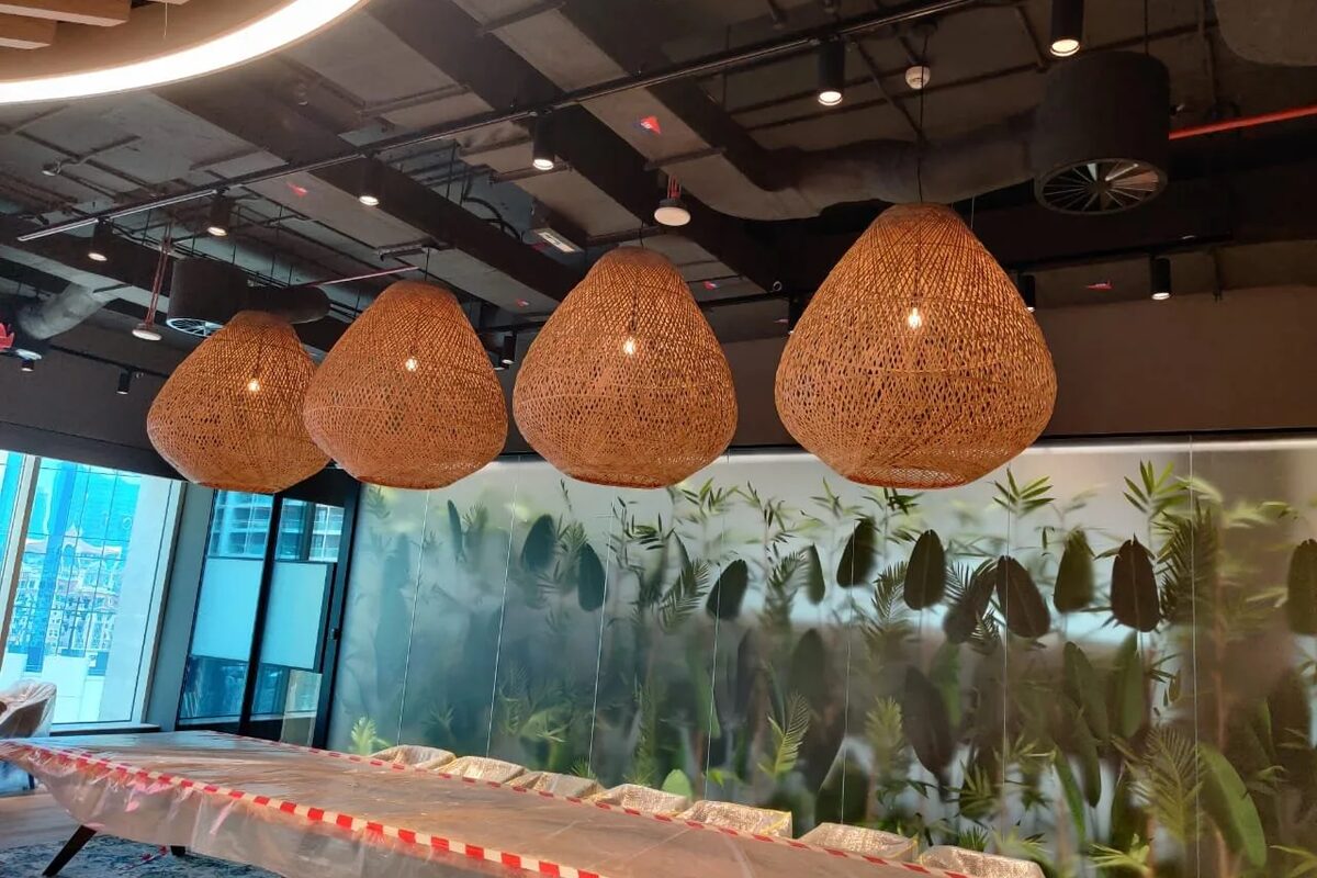 PwC office fit-out at Emaar Boulevard Dubai with track lighting and rattan pendants