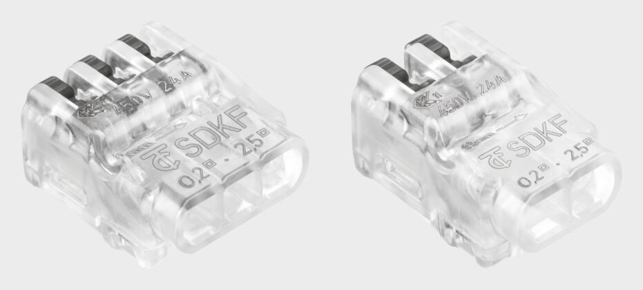 Two Electro Terminal SDKF connectors in clear transparent housings, a three-way and a two-way, with grey clamping levers