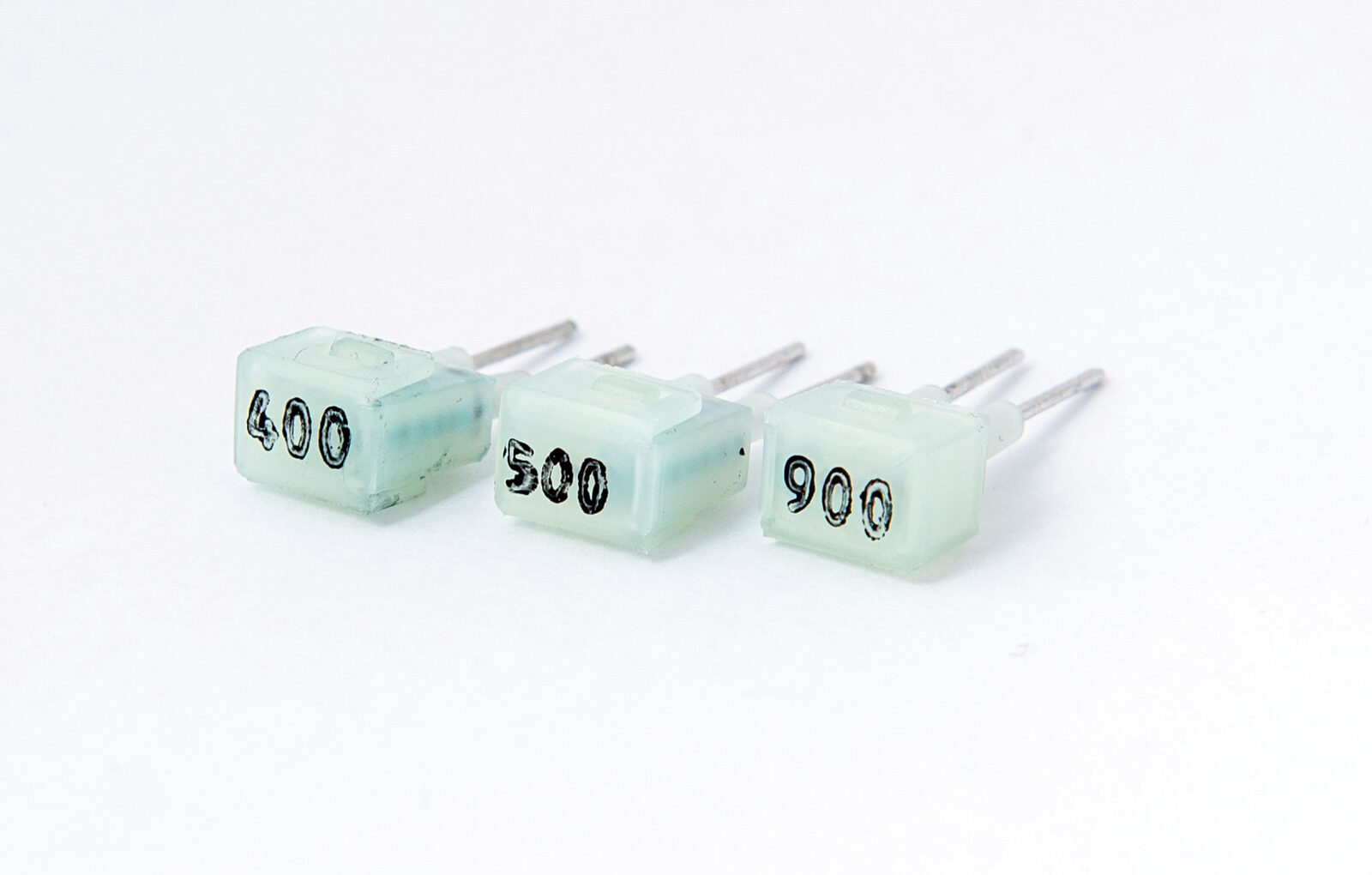 Three Helvar LED-Iset current setting resistors marked 400, 500 and 900